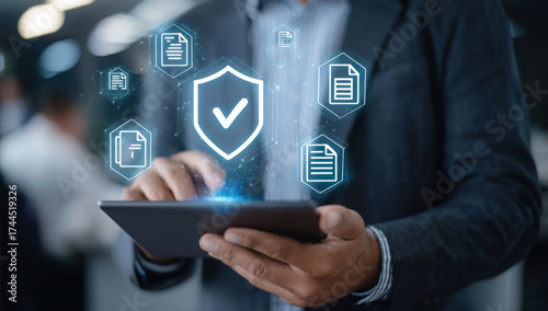Wallpaper Mural Businessman using a tablet with data protection icons showing cybersecurity and privacy for business and technology concepts Torontodigital.ca