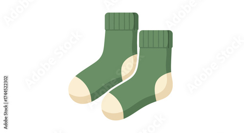 Two matching green wool socks, cozy winter wear against the cold season