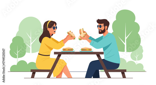 Enjoying A Picnic In The Park With Refreshing Sandwiches And Good Company