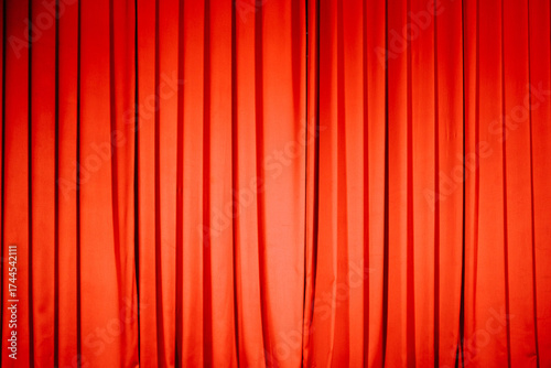 Elegant red stage curtain covering a performance venue
