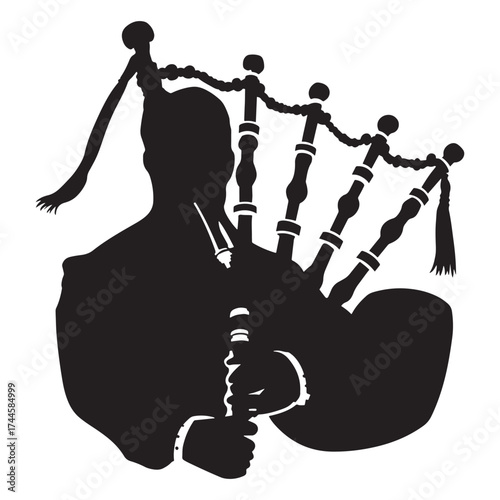 Silhouette of a bagpiper playing traditional scottish bagpipes with drones