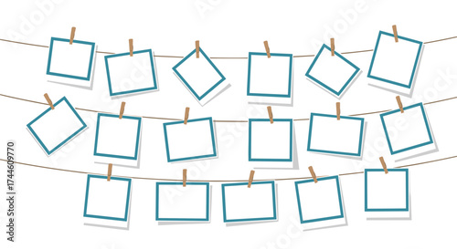 Blank photo frames hanging on a string with clothespins for memories.