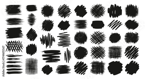 A collection of black hand drawn grunge brush strokes and scribbles.