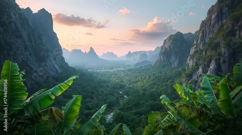 Tropical jungle valley at sunrise with lush banana leaves in the foreground and steep mountain cliffs framing the misty forest, creating a peaceful natural landscape full of greenery and depth.