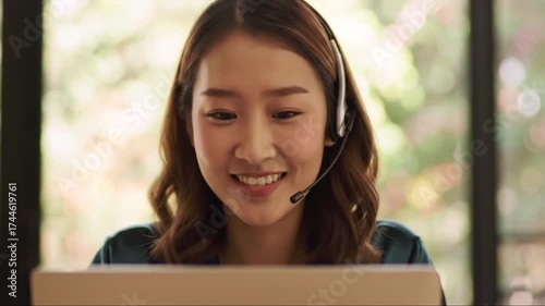 Thoughtful woman with headset gazing downwards