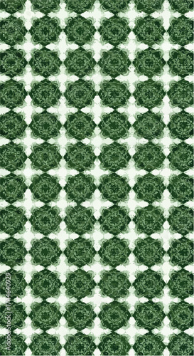 Repeating geometric pattern of green diamond shapes with white highlights creating a textured design.