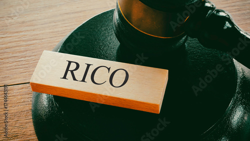 Word RICO on Wooden Block with Gavel and Sound Block Representing Organized Crime Legal Rulings