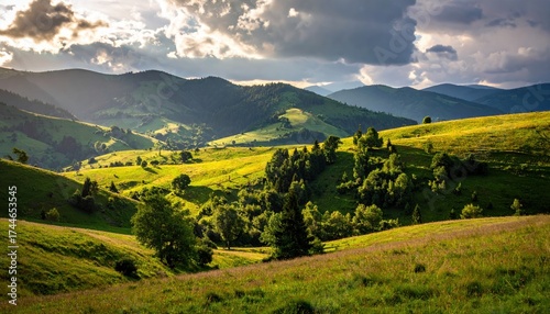 Lush Green Rolling Hills Under Dramatic Clouds with Sunlight Breaking Through in a Serene Landscape
