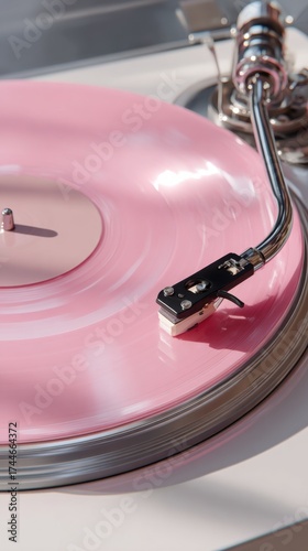 close-up of a spinning pastel pink vinyl record 