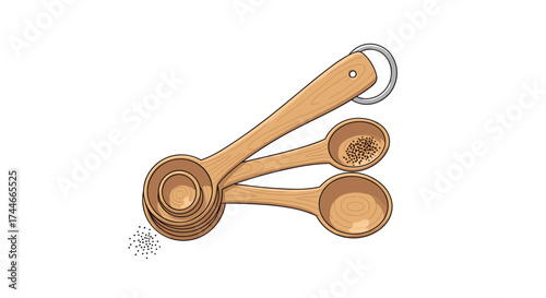 A set of four wooden measuring spoons with a ring for holding them together.