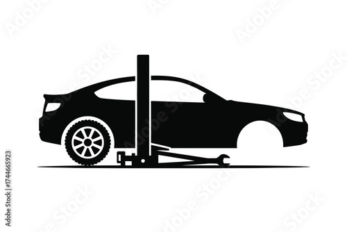 Black silhouette of car on lift with wrench vehicle jack