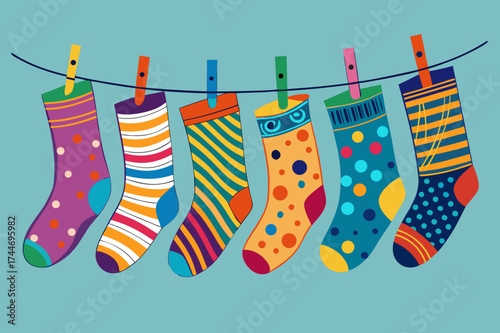 Colorful socks hanging on a clothesline with clothespins