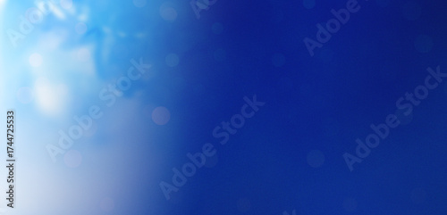 Abstract blue bokeh sky . abstract blue sky background with blurry bokeh light effect. great for design . Abstract blue bokeh background with soft glow and glittering sparkles. Festive, dreamy