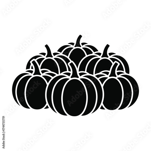 A pile of black and white pumpkins