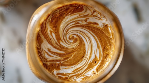 Swirling Creamy Mixture in Glass Jar Captured from Above View