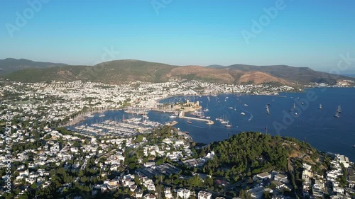 Bodrum, Turkey : Orbiting aerial footage of Bodrum, a beach holiday destination in Turkey. Showing the castle in downtown area and mountain in the background