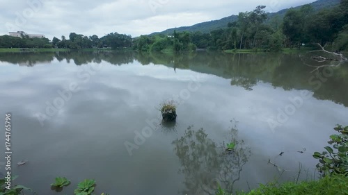 Tranquil Lake with Mountain and Sky Reflections