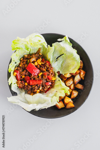 healthy lettuce san choy bow with roasted potato wedges, homemade diabetes friendly meal
