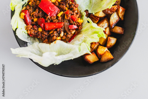 healthy lettuce san choy bow with roasted potato wedges, homemade diabetes friendly meal