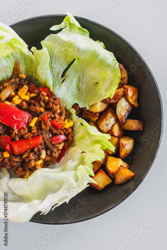 healthy lettuce san choy bow with roasted potato wedges, homemade diabetes friendly meal