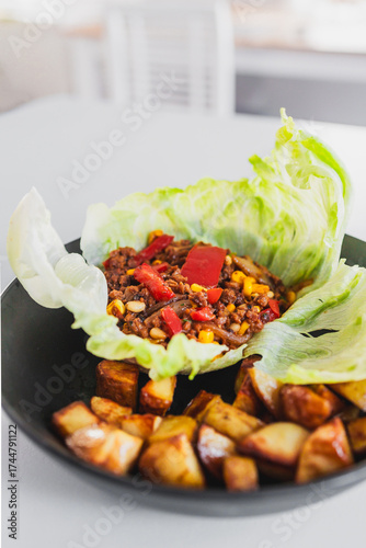 healthy lettuce san choy bow with roasted potato wedges, homemade diabetes friendly meal