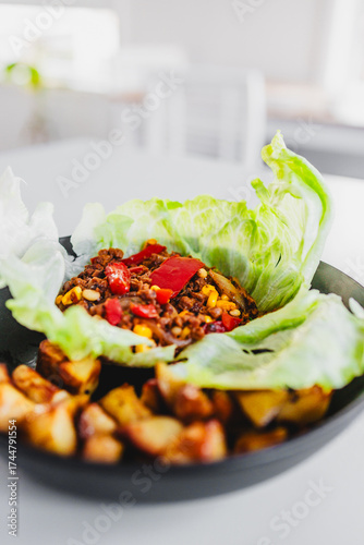 healthy lettuce san choy bow with roasted potato wedges, homemade diabetes friendly meal