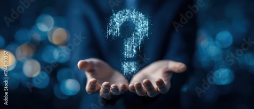 The Question Mark Hologram Floating Above Open Hands Against Blurred Lights