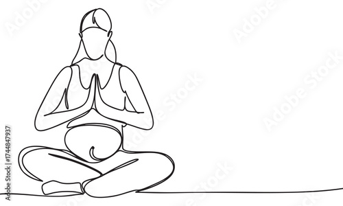 Pregnant woman meditating in lotus position