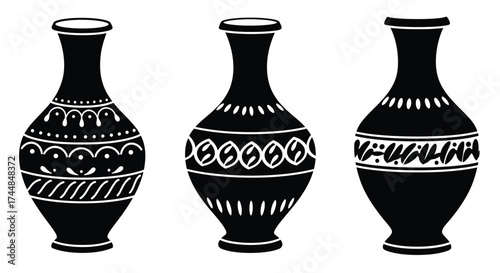 Three decorative black and white vases with distinct patterned designs