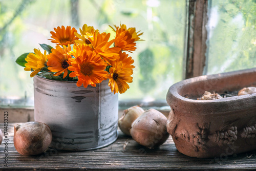 bouquet of orange and yellow marigold officinal flowers and bulbs placed on a...
