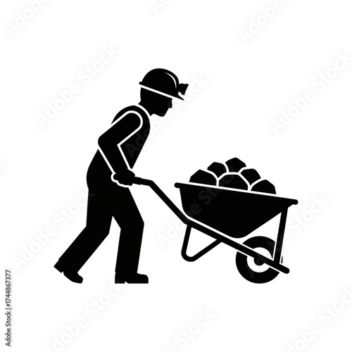 Miner pushing wheelbarrow filled with rocks, hard work and labor concept.