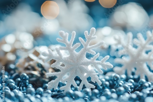White glitter snowflake with blue holiday decorations