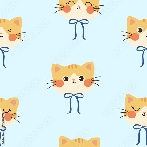 seamless cat head pattern with blue bow on pastel blue background , vector , illustration