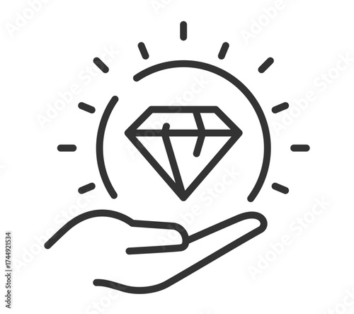 Hand holding diamond with radiating light lines symbolizing luxury and value
