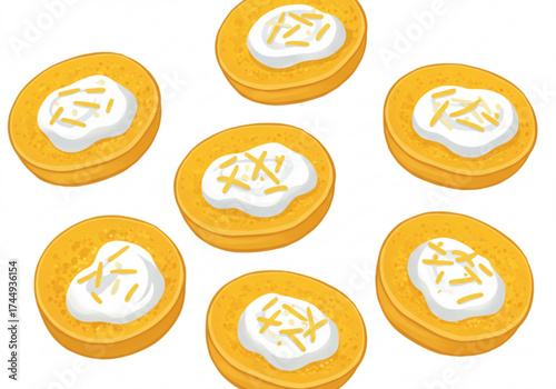 Cheese blinis topped with cream and yellow garnish on white background  