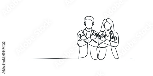 Two doctors with arms crossed