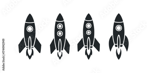 Four Silhouettes of Rockets Launching Upward