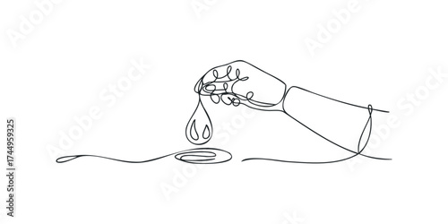 Hand dispensing liquid drops onto spoon