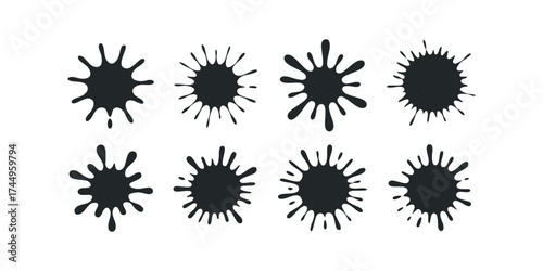 Eight black ink splatters of various sizes and shapes