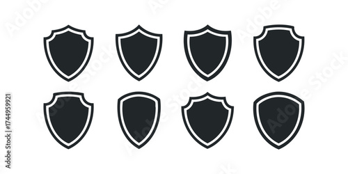 Collection of Eight Black Shield Icons on White Background