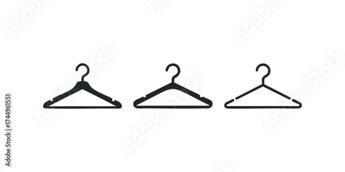 Three black clothes hangers on white background