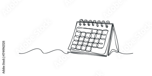 Desk calendar showing a grid of dates and spiral binding