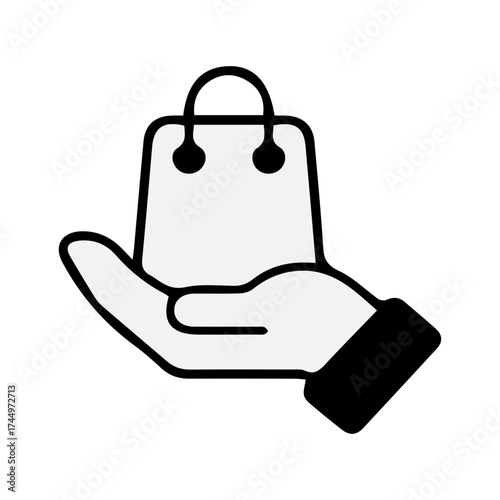 Hand holding shopping bag