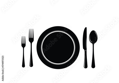 A Simple Arrangement of Dining Utensils Around a Round Plate Ready for a Meal.