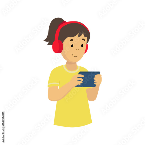 Girl wearing headphones and playing a video game or studying online. 