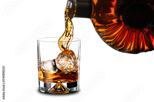 Whiskey Bottle Pouring Whiskey to Glass with Ice Cubes