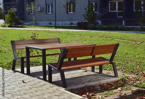 Outdoor wooden table and two benches.