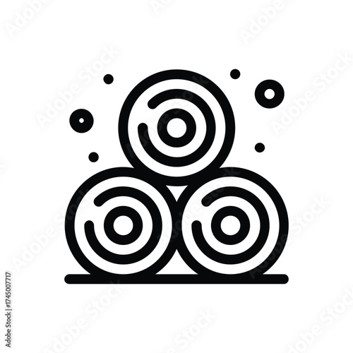 Stack of three round bales with concentric circles on a horizontal base dotted with smaller circles
