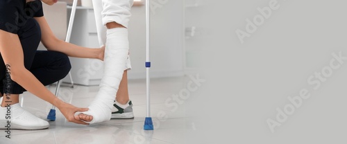 Young woman with broken leg...