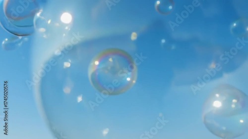 Wallpaper Mural Iridescent Soap Bubbles Gently Floating and Shimmering in a Clear Blue Summer Sky Torontodigital.ca